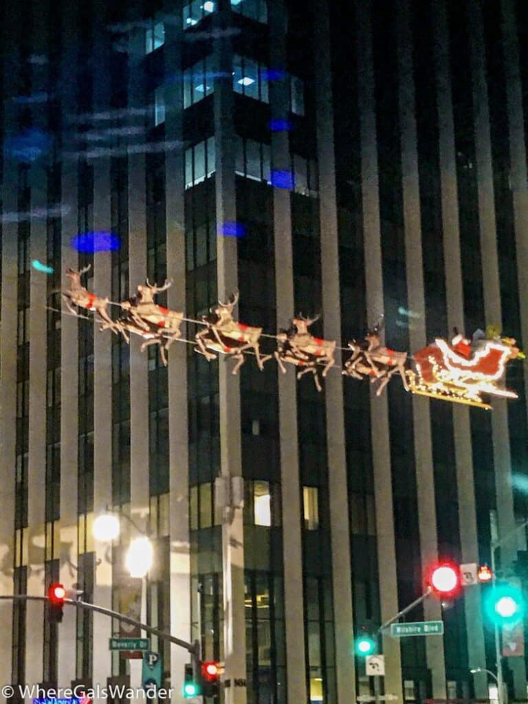 Santa flying above Beverly and Wilshire