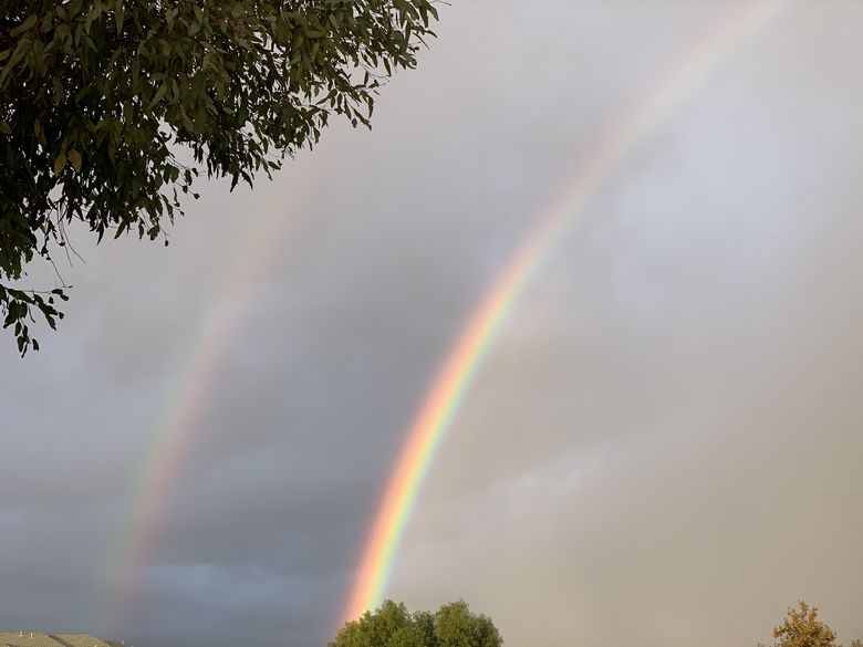 A perfect full arch rainbow and double rainbow outside Los Angeles