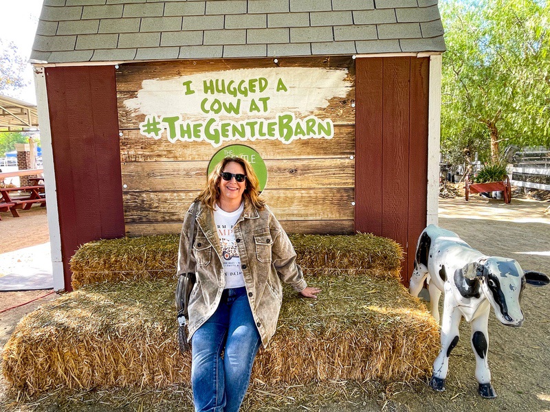 After hugging a cow Zann e from WhereGalsWander hugs a cow at Gentle Barn