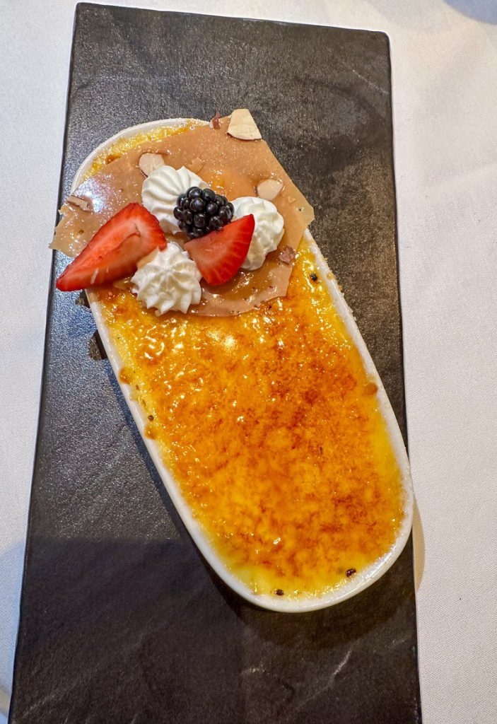 Dining at the Pinnacle Grill aboard the Holland Line Eurodam -a highlight of our Day at Sea Cruise Itinerary. Creme Brûlée